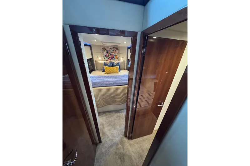 Slide: The Image of Luxurious interior of 2016 Carver C37 Coupe yacht with elegant bedroom design. - 53