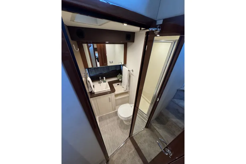 Slide: The Image of Luxurious bathroom in 2016 Carver C37 Coupe yacht, featuring modern fixtures and elegant design. - 54