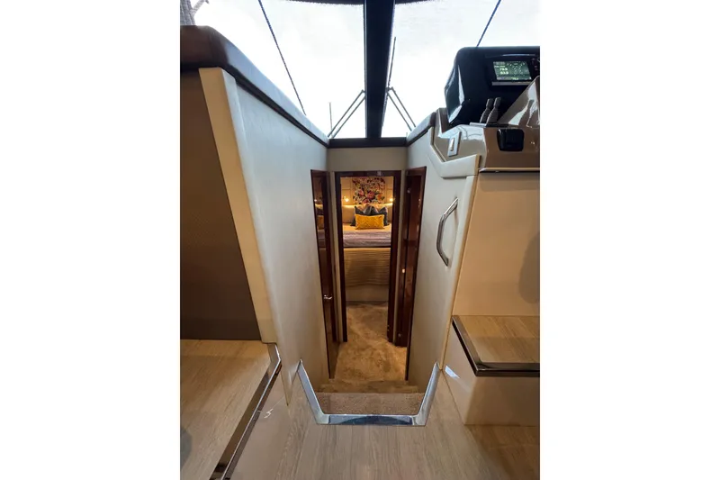 Slide: The Image of Interior view of 2016 Carver C37 Coupe yacht, featuring a cozy cabin entrance. - 57