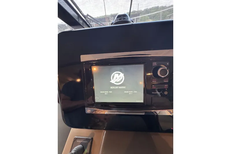 Slide: The Image of Dashboard of a 2016 Carver C37 Coupe displaying Mercury Marine interface. - 60