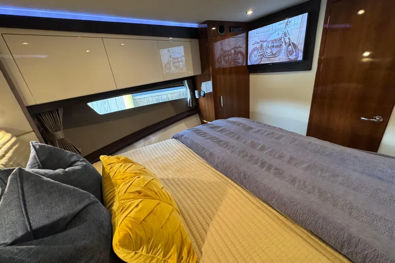 Slide: The Image of Luxurious interior of 2016 Carver C37 Coupe with cozy bedding and modern decor. - 61