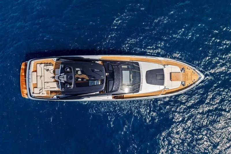 Slide: The Image of Aerial view of 2022 Riva 90' Argo yacht cruising on blue ocean waters. - 11