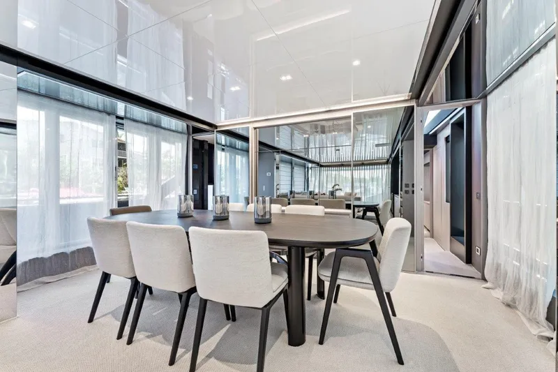 Slide: The Image of Luxurious dining area on 2022 Riva 90' Argo yacht with modern decor and elegant furnishings. - 4