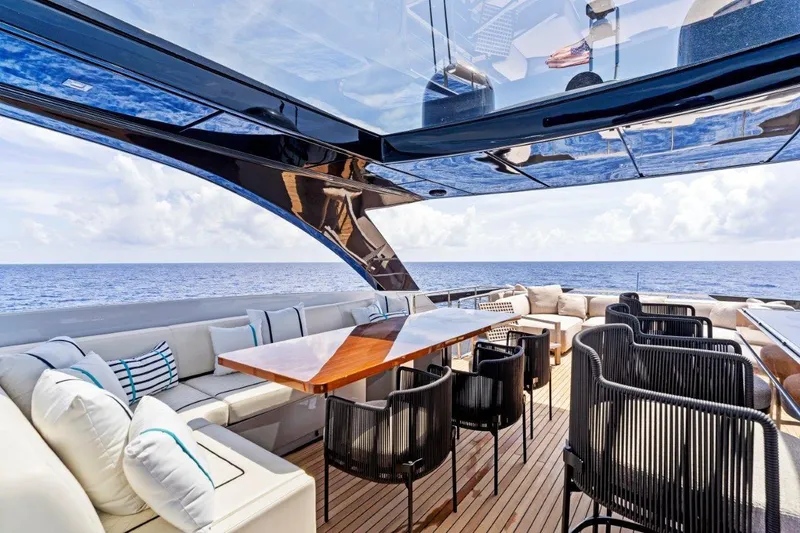 Slide: The Image of Luxurious 2022 Riva 90' Argo yacht deck with elegant seating and ocean view. - 5