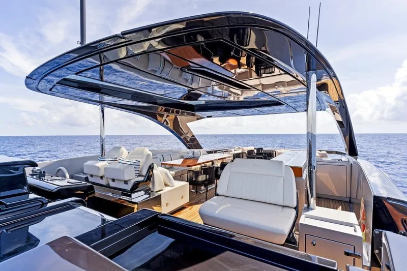 Slide: The Image of Luxurious 2022 Riva 90' Argo yacht with sleek design and spacious deck on open sea. - 7