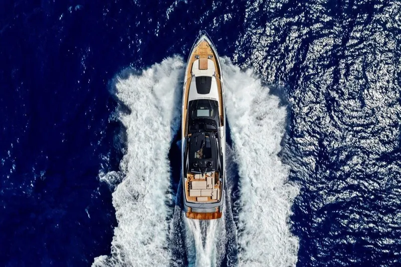 Slide: The Image of Aerial view of 2022 Riva 90' Argo yacht cruising on deep blue ocean. - 9