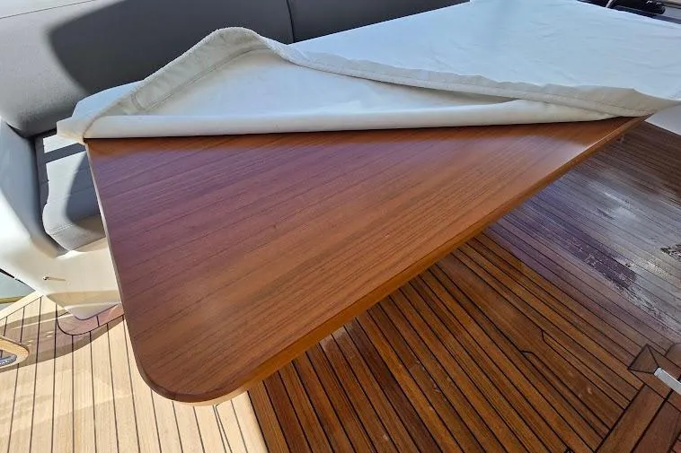 Slide: The Image of Luxurious wooden table on 2024 Sirena 58 Flybridge MY yacht deck. - 14