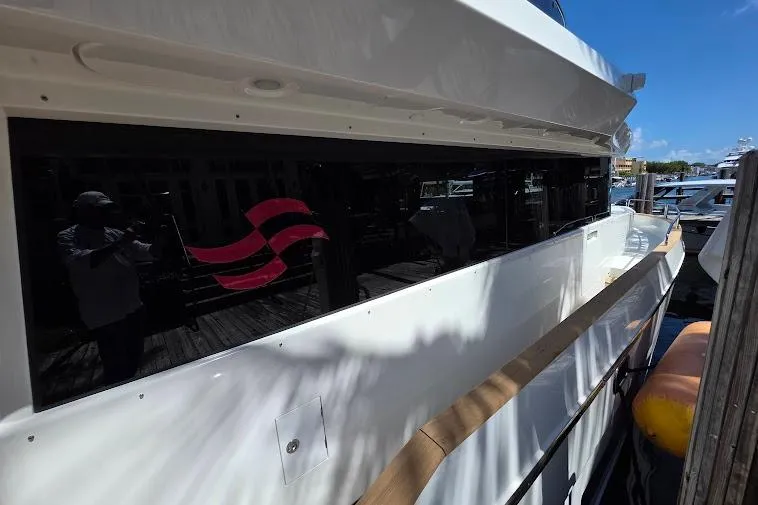 Slide: The Image of 2024 Sirena 58 Flybridge MY yacht docked, showcasing sleek design and modern features. - 19