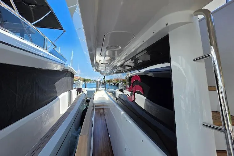 Slide: The Image of 2024 Sirena 58 Flybridge MY yacht docked, showcasing sleek design and modern features. - 20