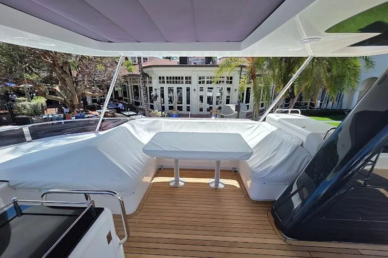 Slide: The Image of Luxurious 2024 Sirena 58 Flybridge yacht with spacious outdoor seating and dining area. - 25