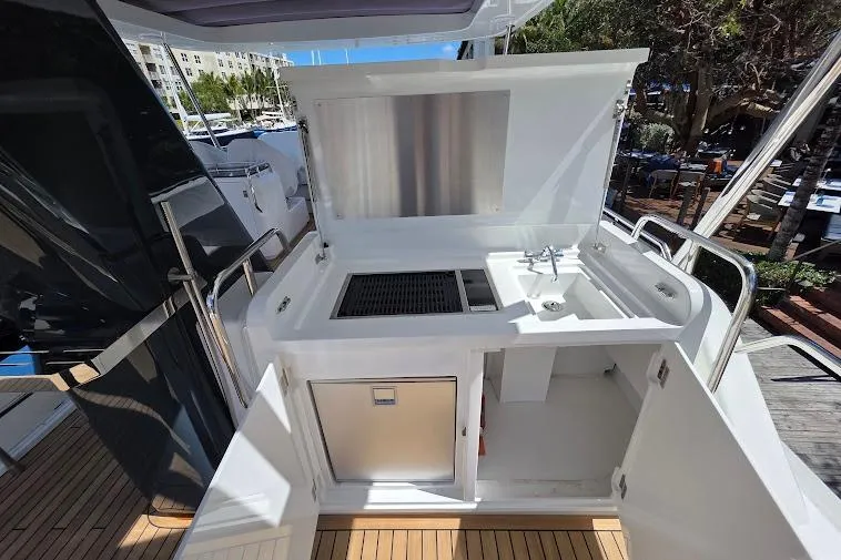 Slide: The Image of Outdoor kitchen on 2024 Sirena 58 Flybridge MY yacht with grill and sink. - 28