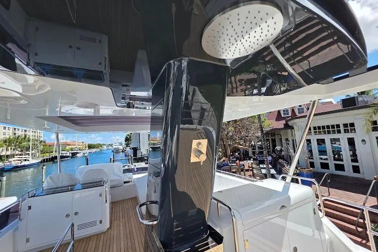 Slide: The Image of 2024 Sirena 58 Flybridge MY yacht with sleek design and spacious deck at a marina. - 32