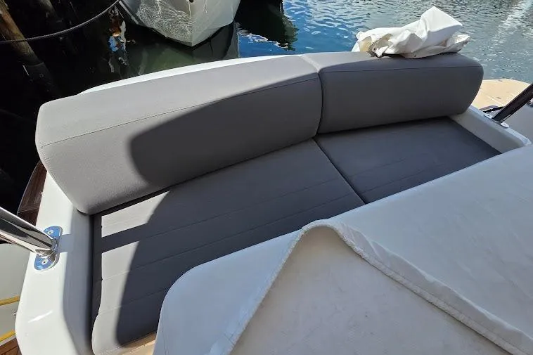 Slide: The Image of Luxurious seating on 2024 Sirena 58 Flybridge MY yacht, docked by the water. - 37