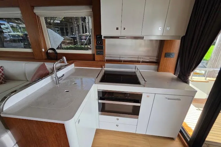 Slide: The Image of Modern kitchen interior on 2024 Sirena 58 Flybridge MY yacht, featuring sleek countertops and appliances. - 41
