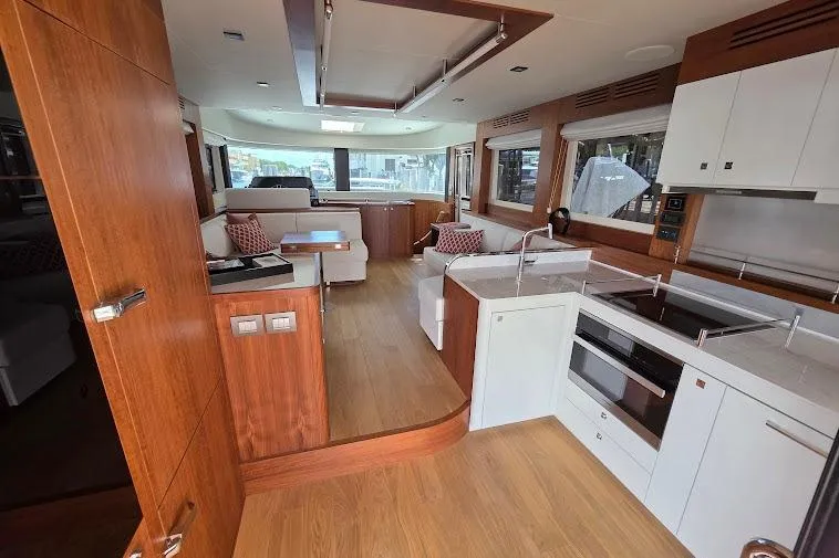 Slide: The Image of Luxurious interior of 2024 Sirena 58 Flybridge MY yacht with modern kitchen and seating area. - 42