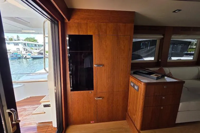 Slide: The Image of Interior of 2024 Sirena 58 Flybridge MY yacht with wooden cabinetry and water view. - 46