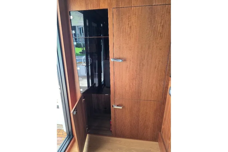 Slide: The Image of Interior view of 2024 Sirena 58 Flybridge MY yacht with wooden cabinetry. - 47