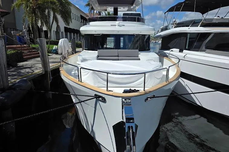 Slide: The Image of 2024 Sirena 58 Flybridge MY yacht docked, showcasing sleek design and luxurious features. - 5