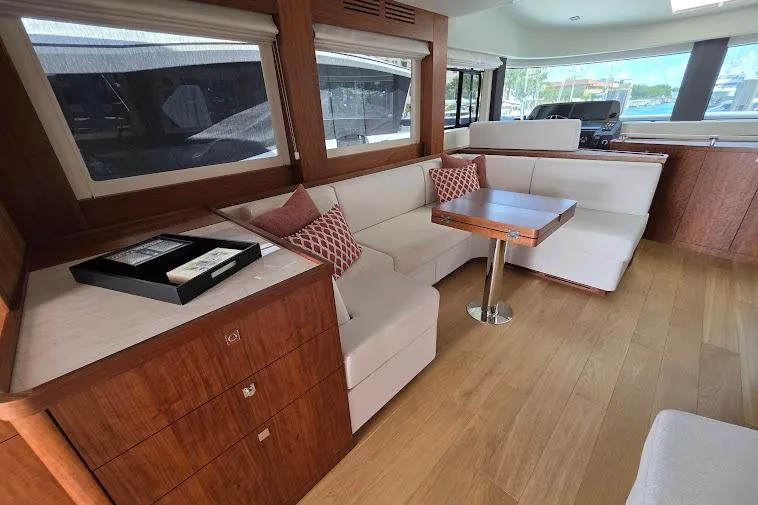 Slide: The Image of Luxurious interior of 2024 Sirena 58 Flybridge MY yacht with elegant seating and wooden accents. - 52
