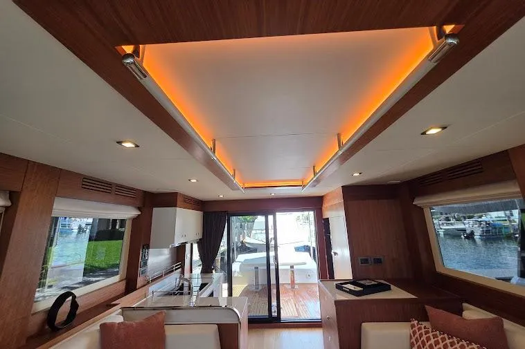 Slide: The Image of Luxurious interior of 2024 Sirena 58 Flybridge MY yacht with modern lighting and elegant design. - 55