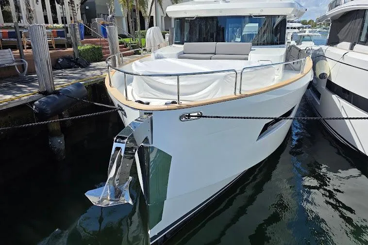 Slide: The Image of 2024 Sirena 58 Flybridge MY yacht docked, showcasing sleek design and modern features. - 6