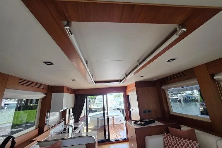 Slide: The Image of Luxurious interior of 2024 Sirena 58 Flybridge MY yacht with modern design and large windows. - 64