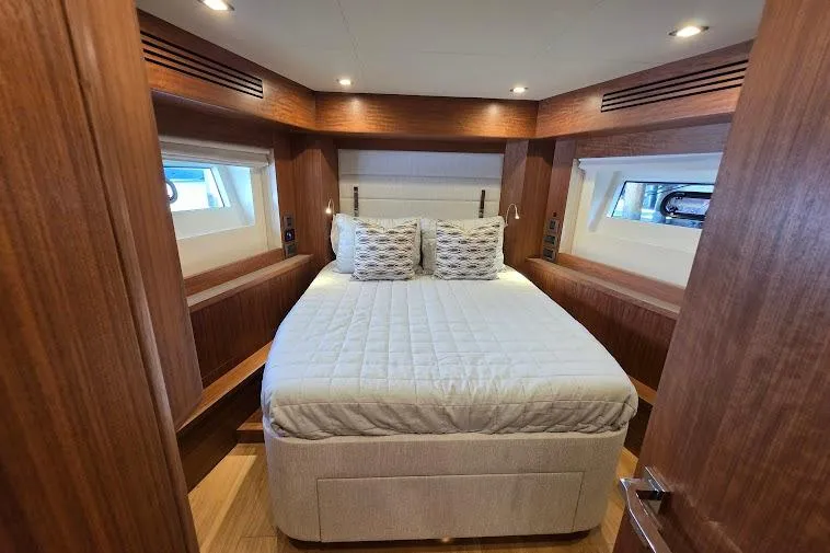 Slide: The Image of Luxurious cabin interior of 2024 Sirena 58 Flybridge MY yacht with elegant wood finishes. - 72