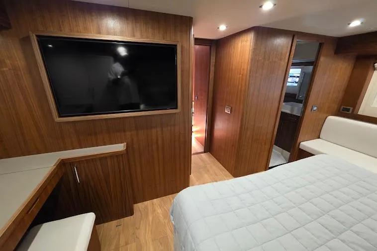 Slide: The Image of Luxurious 2024 Sirena 58 Flybridge MY cabin with wood paneling and modern amenities. - 78