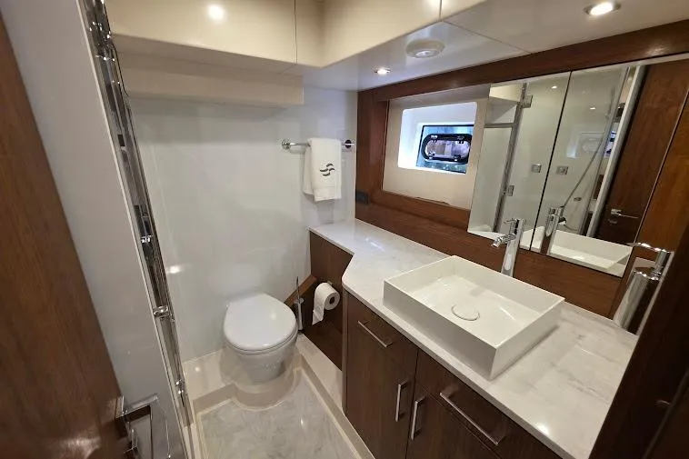 Slide: The Image of Luxurious bathroom in 2024 Sirena 58 Flybridge MY yacht with modern fixtures and elegant design. - 79