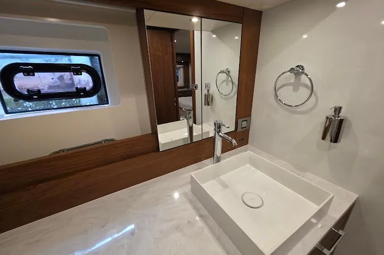 Slide: The Image of Luxurious bathroom in 2024 Sirena 58 Flybridge MY yacht with modern sink and mirror. - 81