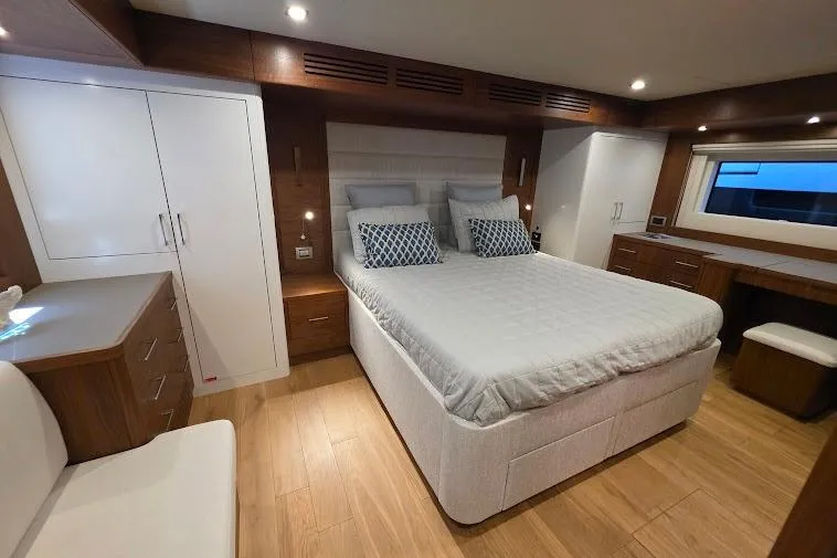 Slide: The Image of Luxurious bedroom interior of 2024 Sirena 58 Flybridge MY yacht with modern furnishings. - 82