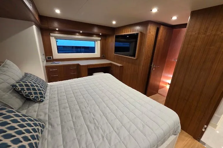 Slide: The Image of Luxurious cabin interior of 2024 Sirena 58 Flybridge MY yacht with wood paneling and modern amenities. - 83