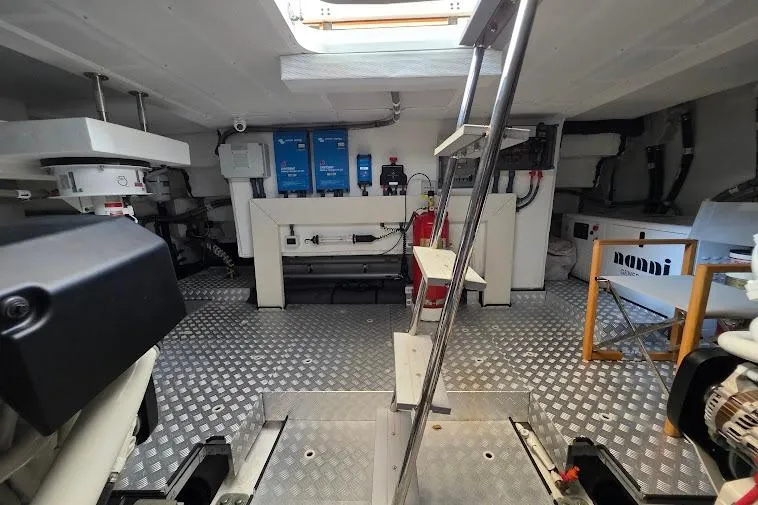 Slide: The Image of Engine room of 2024 Sirena 58 Flybridge MY yacht with equipment and ladder. - 92