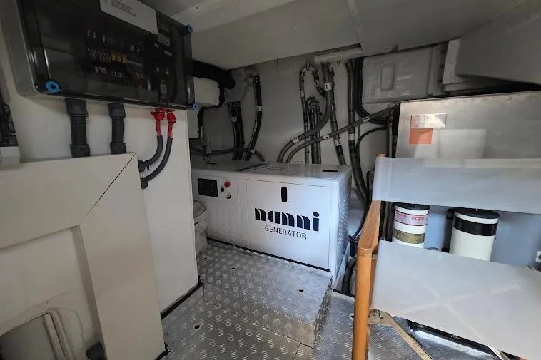 Slide: The Image of Engine room of 2024 Sirena 58 Flybridge MY with Nanni generator and electrical systems. - 97