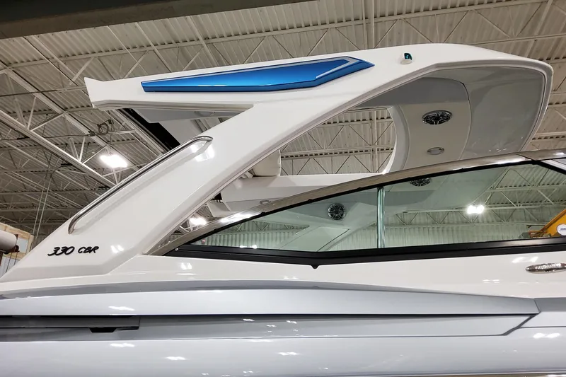 Slide: The Image of 2026 Formula 330 Crossover Bowrider I/O in showroom, showcasing sleek design and modern features. - 10