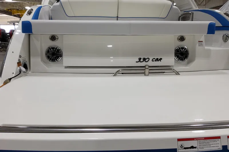 Slide: The Image of 2026 Formula 330 Crossover Bowrider I/O, rear view with speakers and seating. - 4