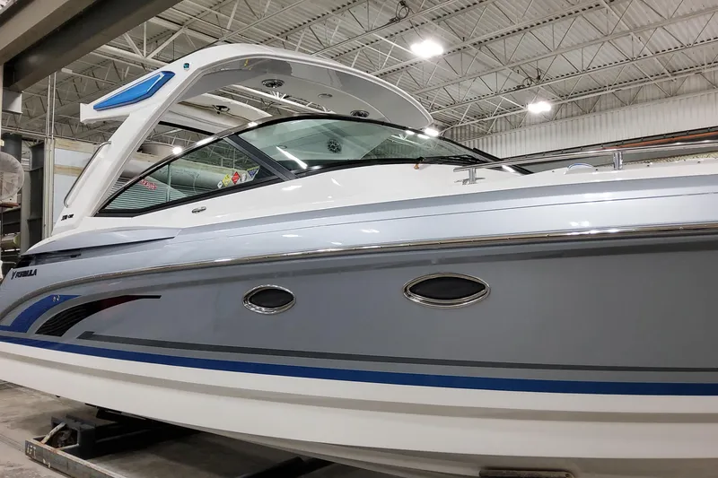 Slide: The Image of 2026 Formula 330 Crossover Bowrider I/O in showroom, showcasing sleek design and modern features. - 7