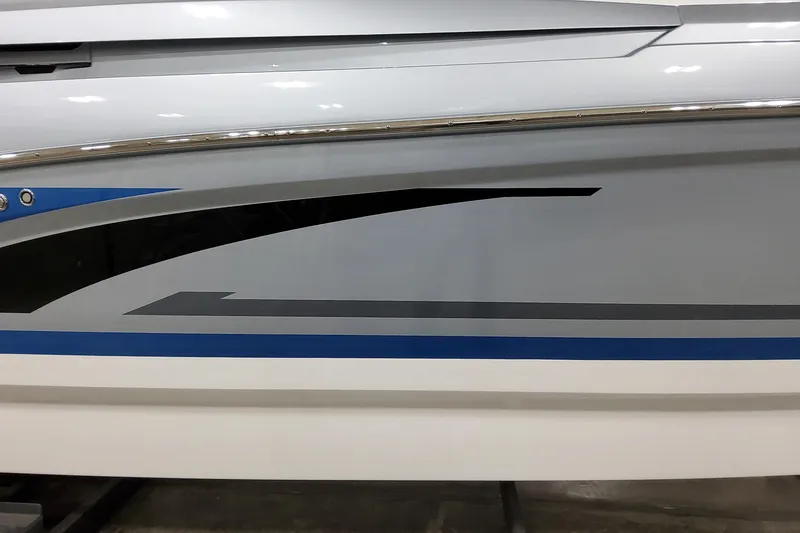 Slide: The Image of 2026 Formula 330 Crossover Bowrider I/O boat side view with sleek design and graphics. - 9