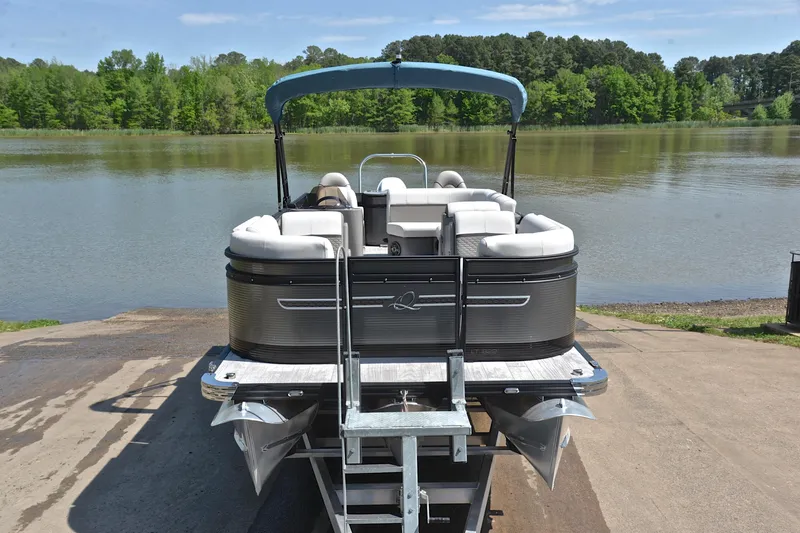 Slide: The Image of 2022 Qwest E822 pontoon boat on a trailer by a scenic lake. - 17