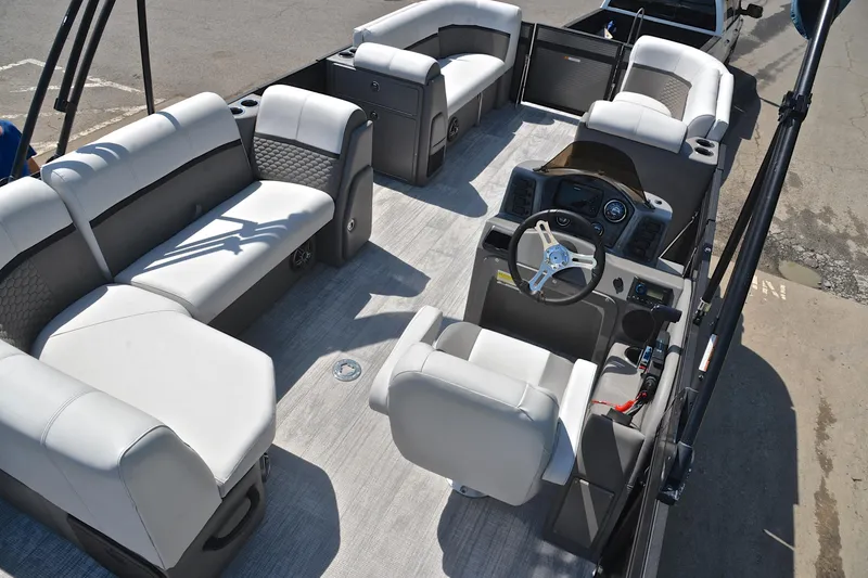 Slide: The Image of Luxurious interior of 2022 Qwest E822 pontoon boat with plush seating and modern helm. - 19