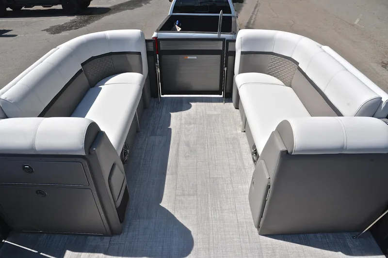 Slide: The Image of 2022 Qwest E822 pontoon boat interior with gray seating and flooring. - 21