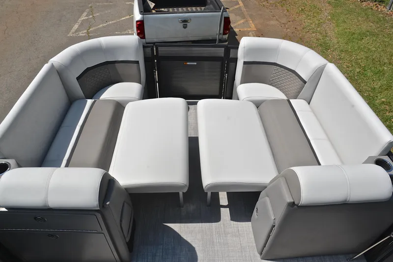 Slide: The Image of Luxurious seating on 2022 Qwest E822 pontoon boat, featuring plush gray and white upholstery. - 22