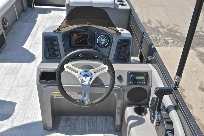 Slide: The Image of Steering console of 2022 Qwest E822 boat with modern controls and navigation system. - 27