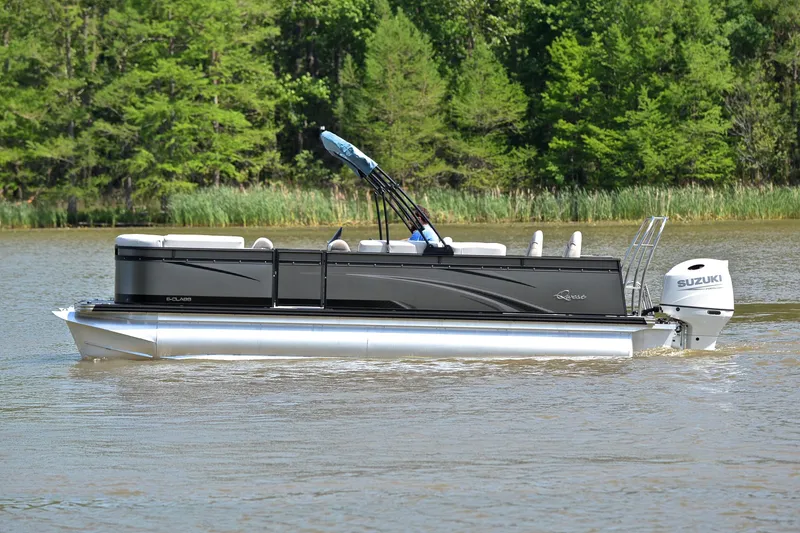Slide: The Image of 2022 Qwest E822 pontoon boat cruising on a lake with lush green trees. - 8
