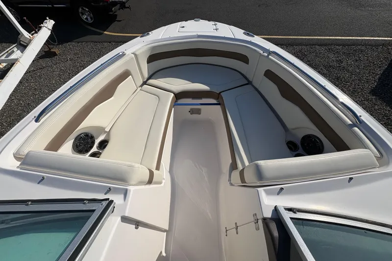 Slide: The Image of 2015 Chaparral 246 SSi boat interior with spacious seating and built-in speakers. - 16