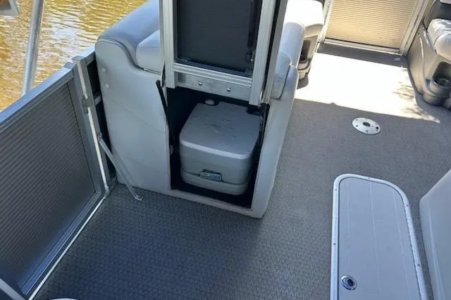 Slide: The Image of Honda outboard motor and Power-Pole anchor on 2020 Avalon 2685 LSZ QL boat by a dock. - 11