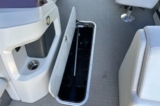 Slide: The Image of 2020 Avalon 2685 LSZ QL boat interior with storage compartment and seating. - 12
