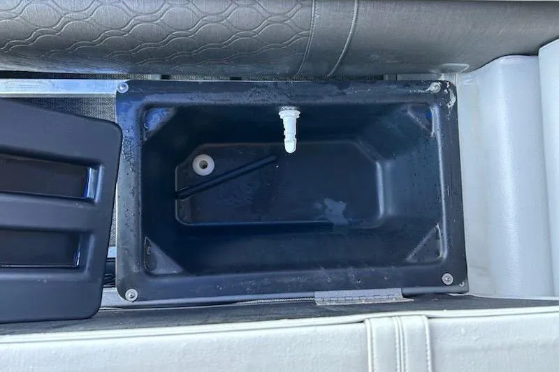 Slide: The Image of Open storage compartment in 2020 Avalon 2685 LSZ QL boat with visible items inside. - 14