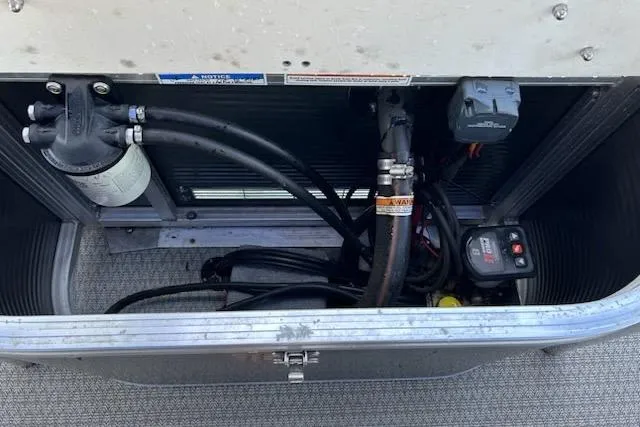 Slide: The Image of Battery compartment of 2020 Avalon 2685 LSZ QL boat, featuring dual batteries and wiring. - 17