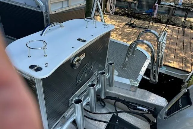 Slide: The Image of 2020 Avalon 2685 LSZ QL boat interior with steering console and seating area. - 7